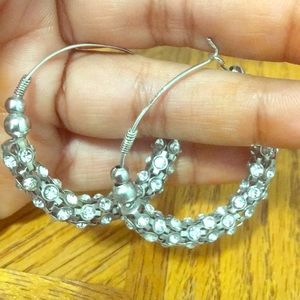 Alluring Silver hoop earrings.